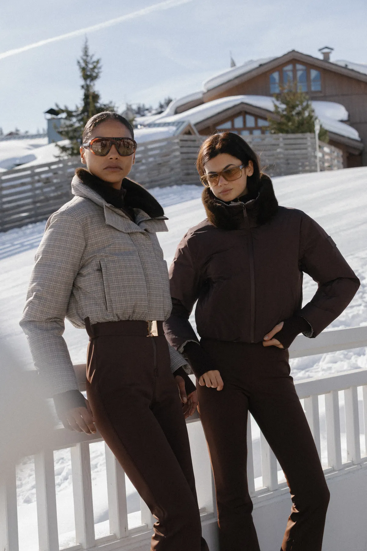Two women wearing AMERL ski outfits during a luxury ski holiday in Courchevel.